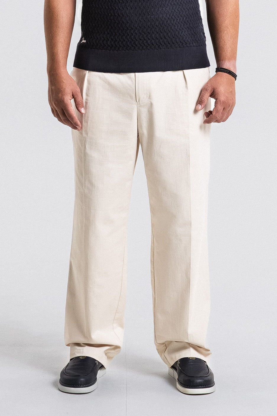 SEAM Poplin Pleated Trouser in Wheat, lower view showing fabric drape and fit