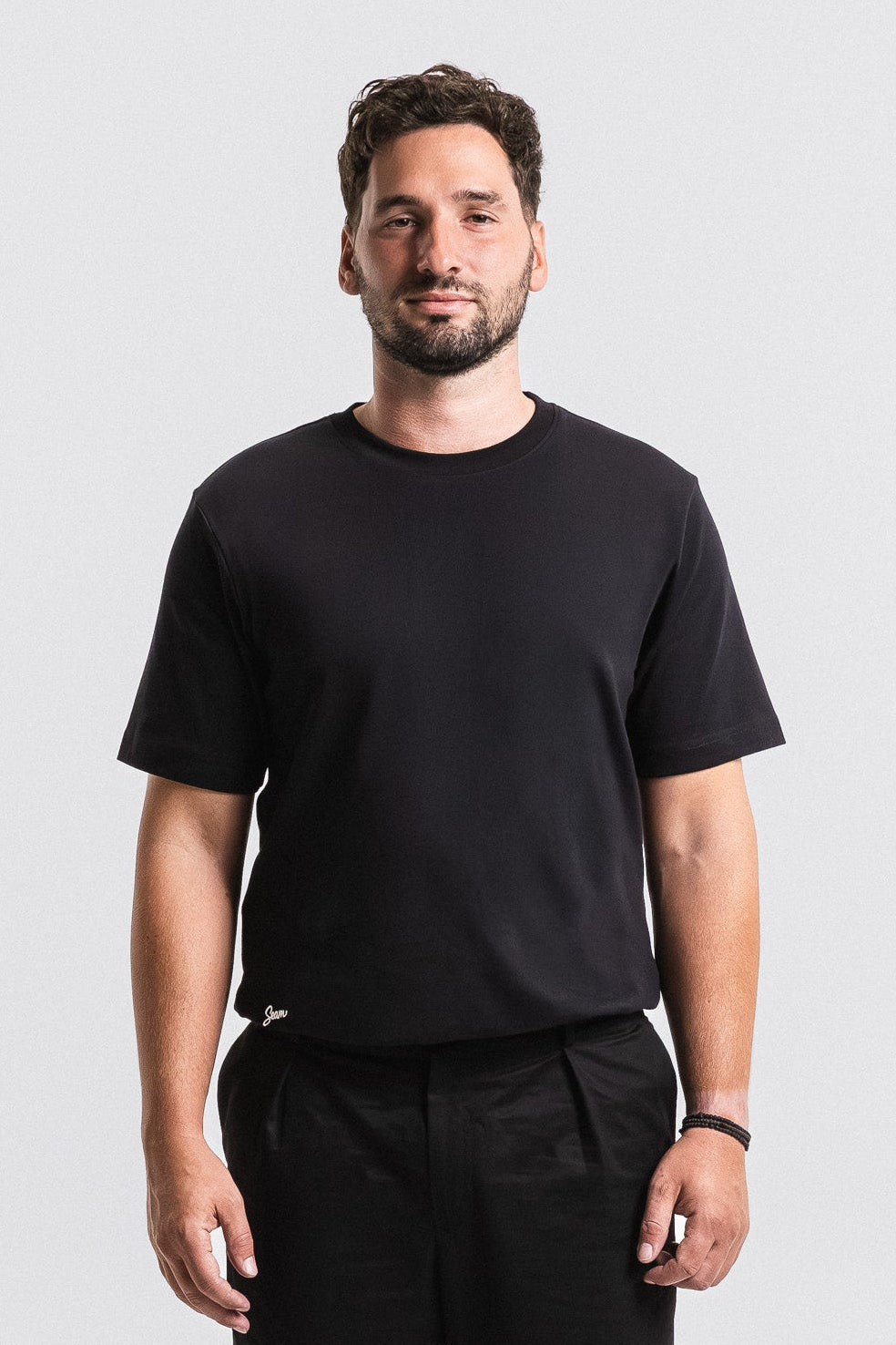SEAM Relaxed Fit Cotton T-Shirt in Black, front view showing relaxed fit and crew neck