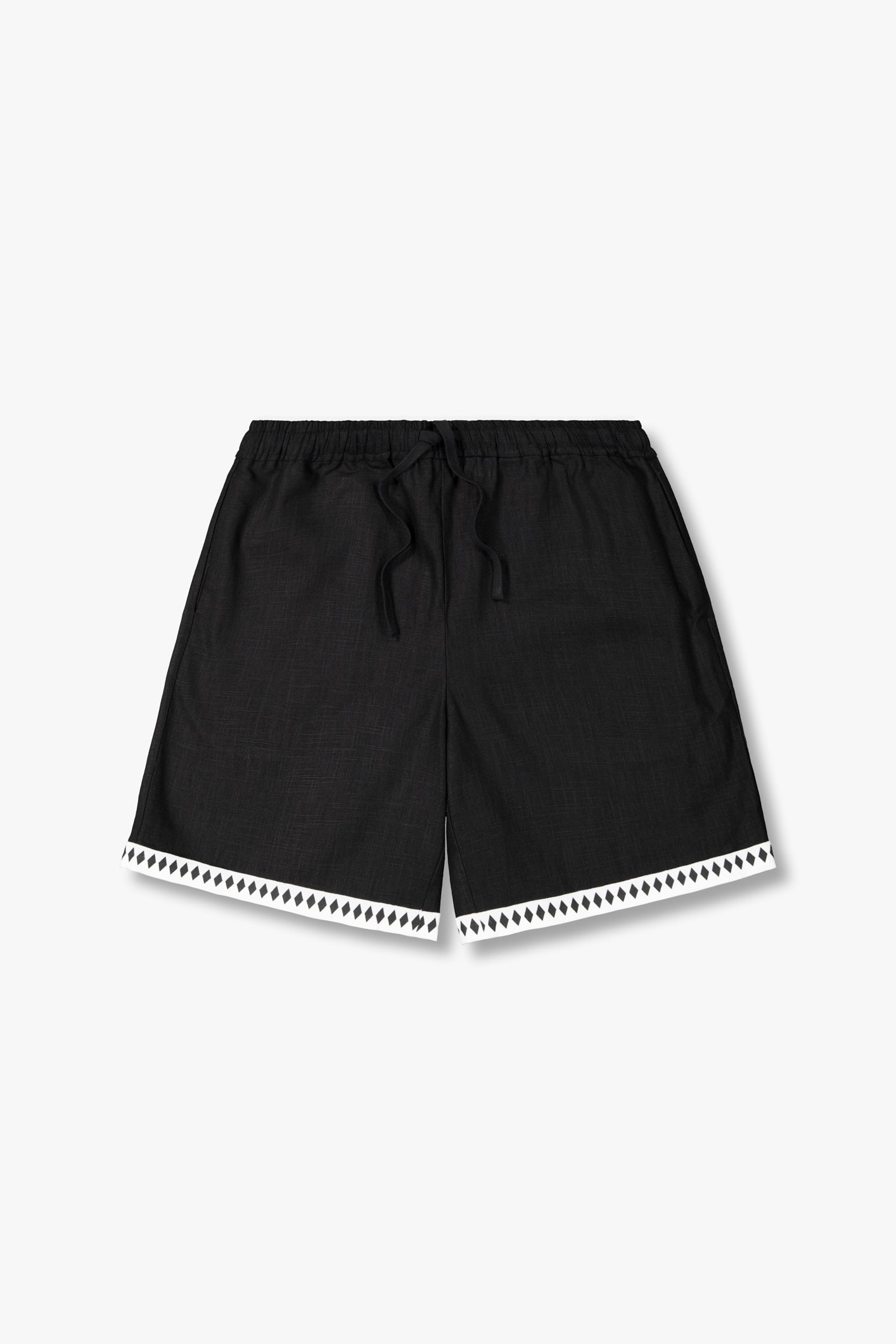 SEAM Diamond Trim Linen Shorts in Black, flat lay showing contrast diamond trim at hem