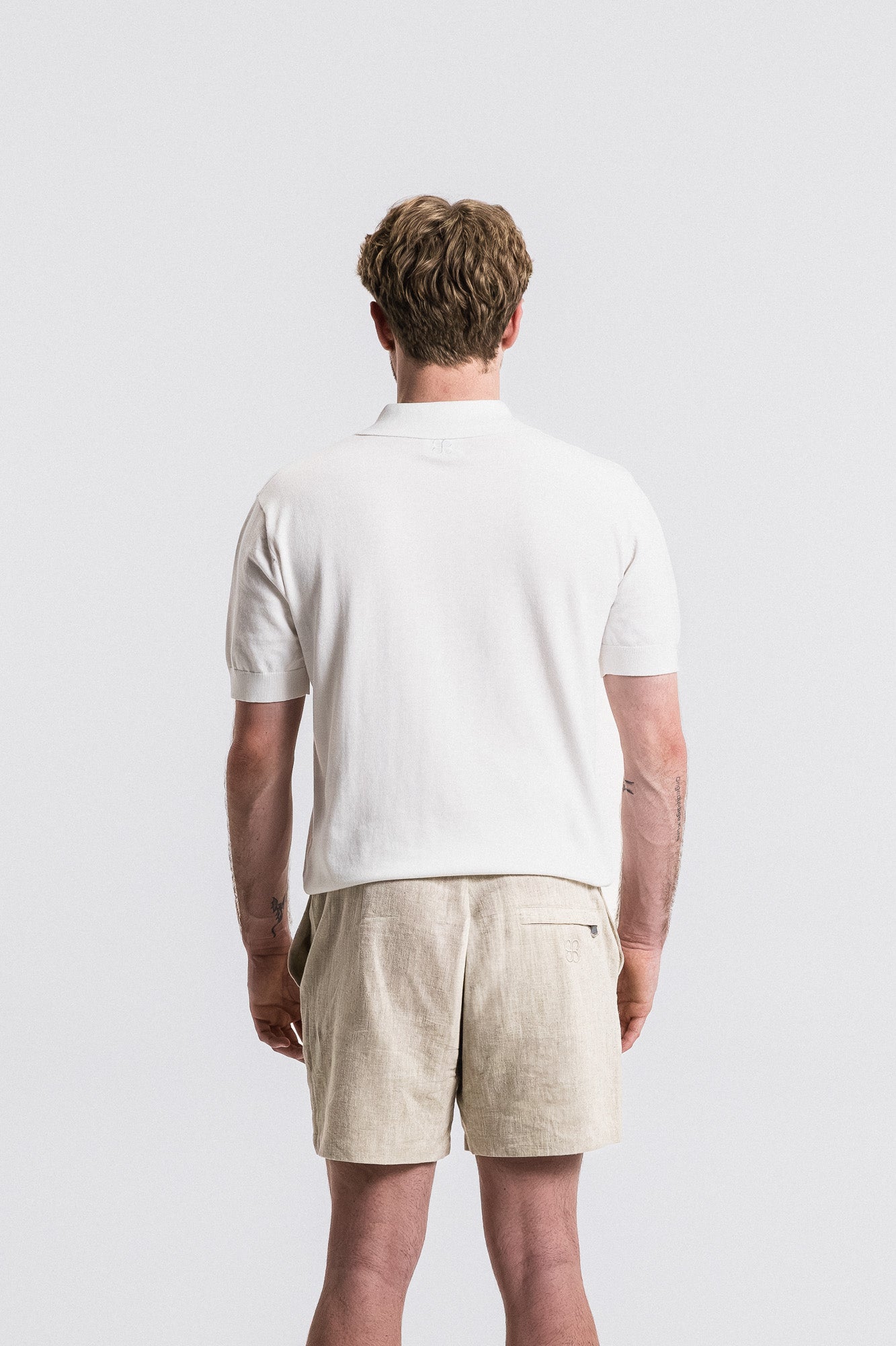 SEAM Cotton Knit Open Neck Polo in White, front view showing open collar design