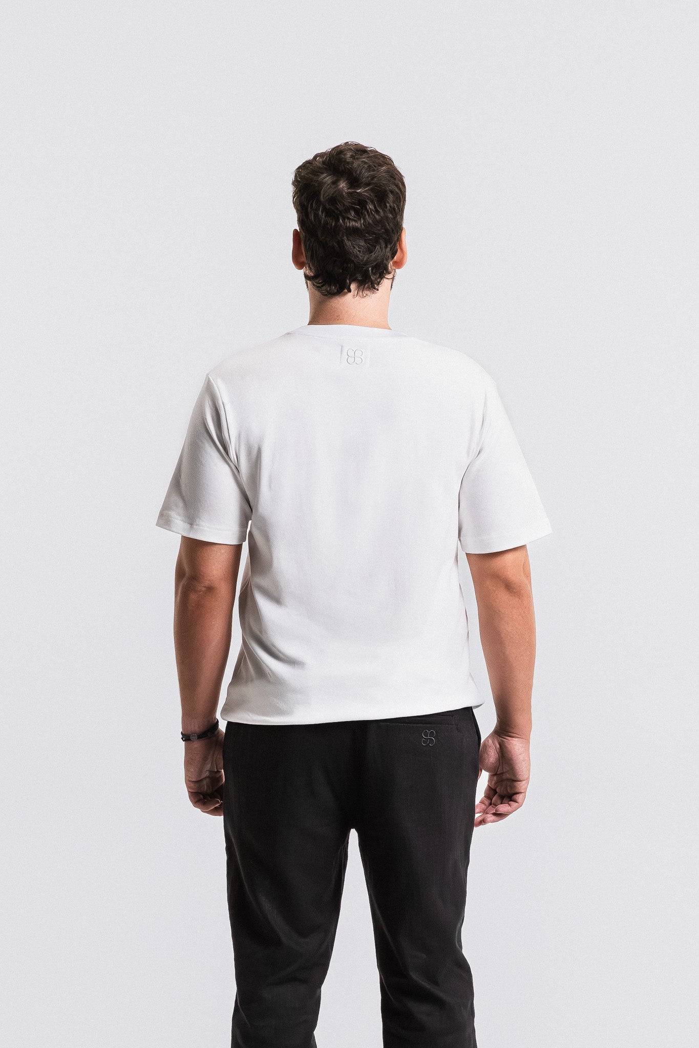 SEAM Relaxed Fit Cotton T-Shirt in White, full outfit view with black pants