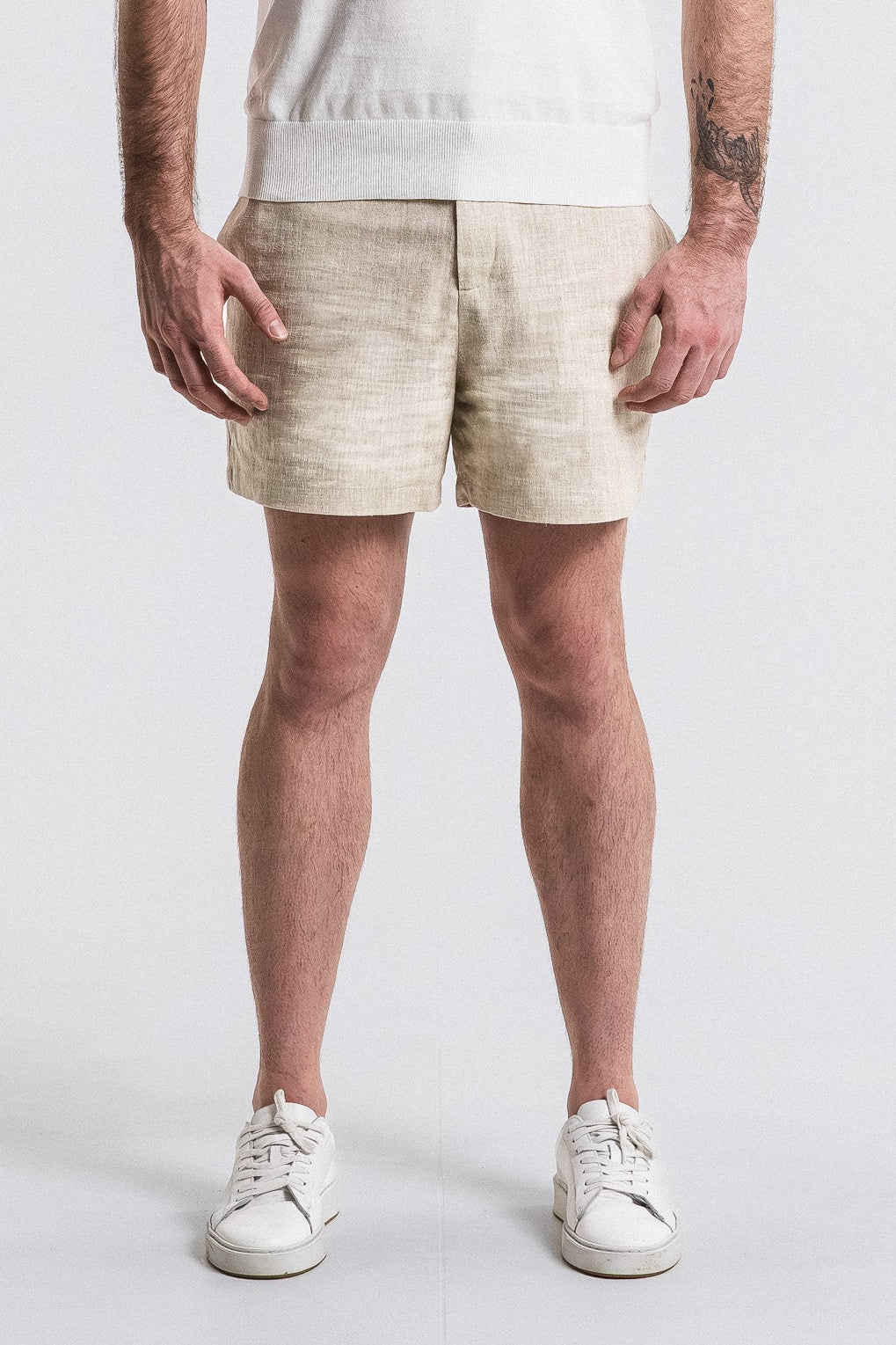 SEAM Side Tab Linen Short in Wheat, lower view showing fabric drape and mid-thigh cut