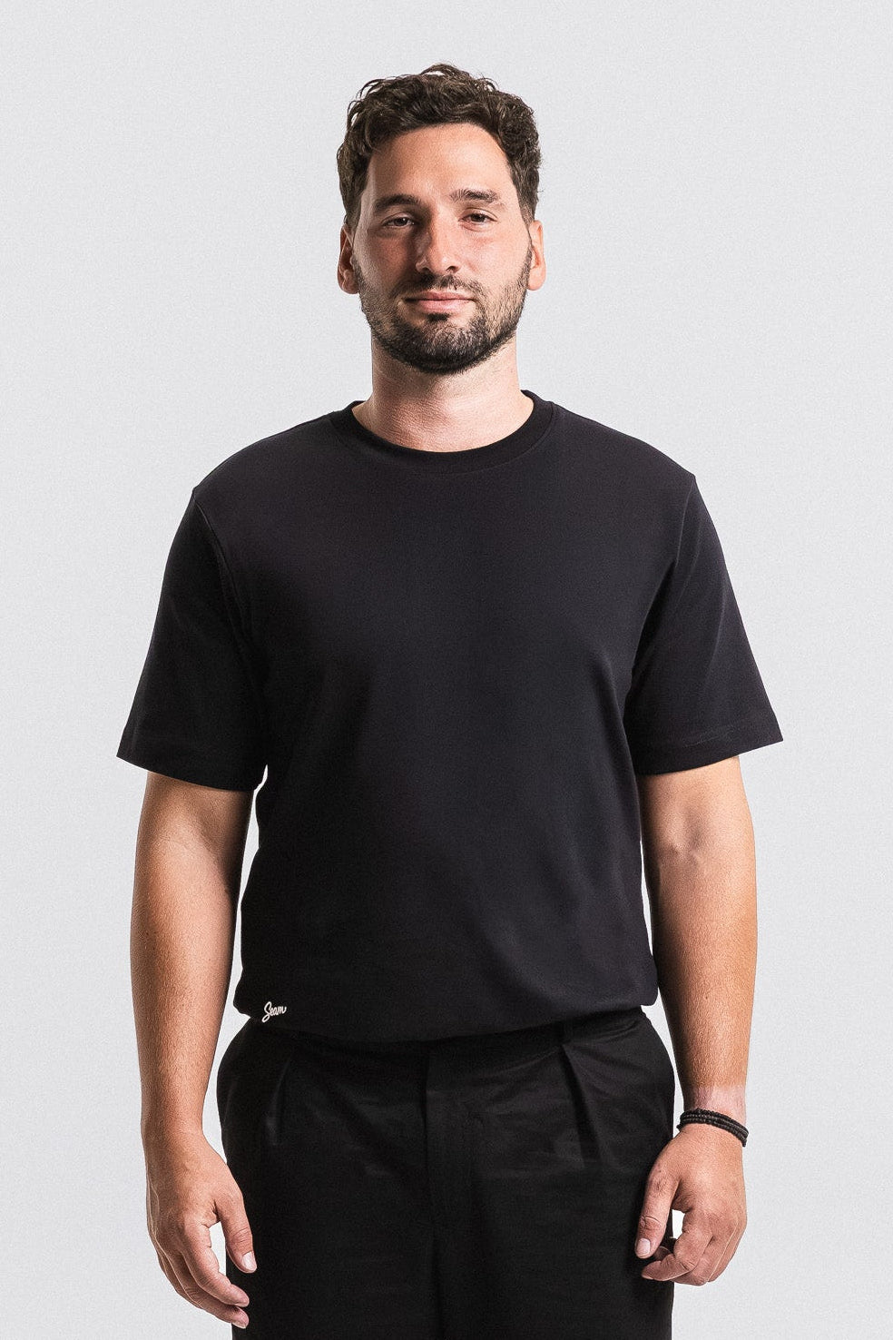 SEAM Relaxed Fit Cotton T-Shirt in Black, front view showing relaxed fit and crew neck