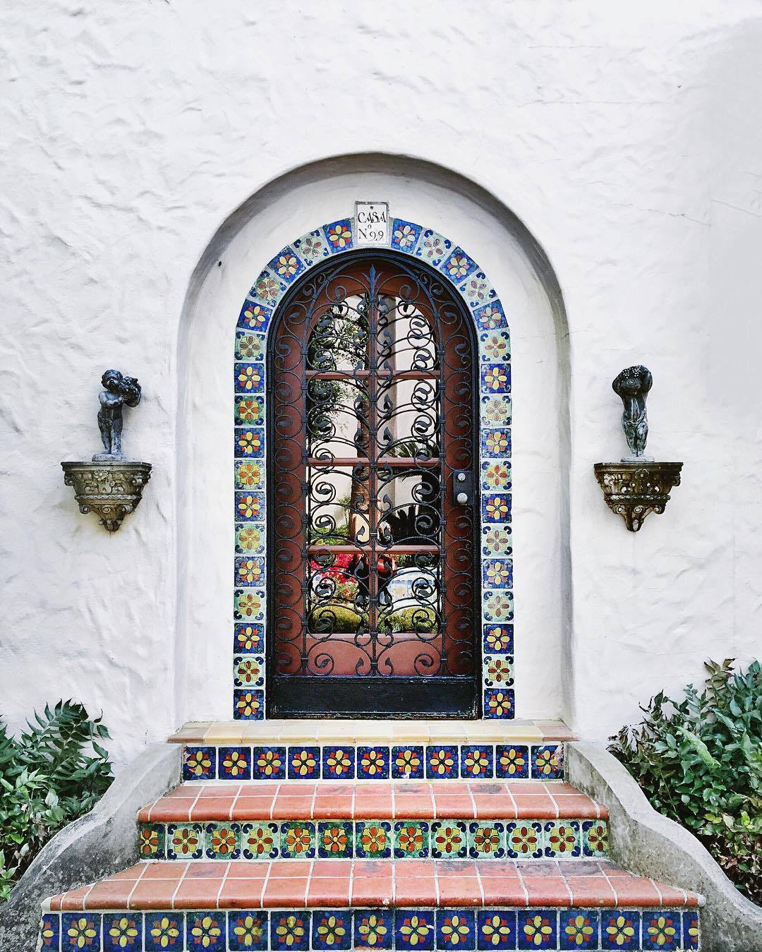Decorative entrance with tiled archway and steps