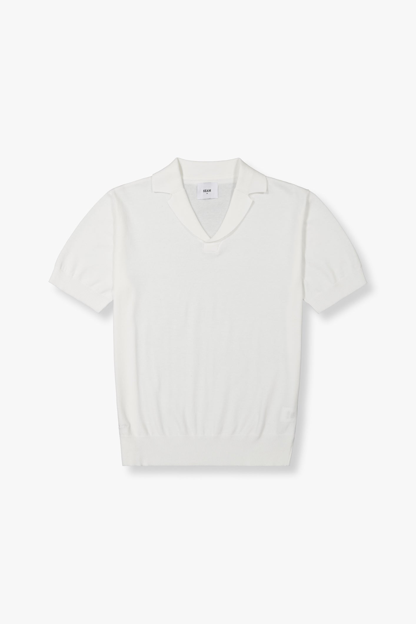 SEAM Cotton Knit Open Neck Polo in White, flat lay showing open collar and jacquard cotton texture