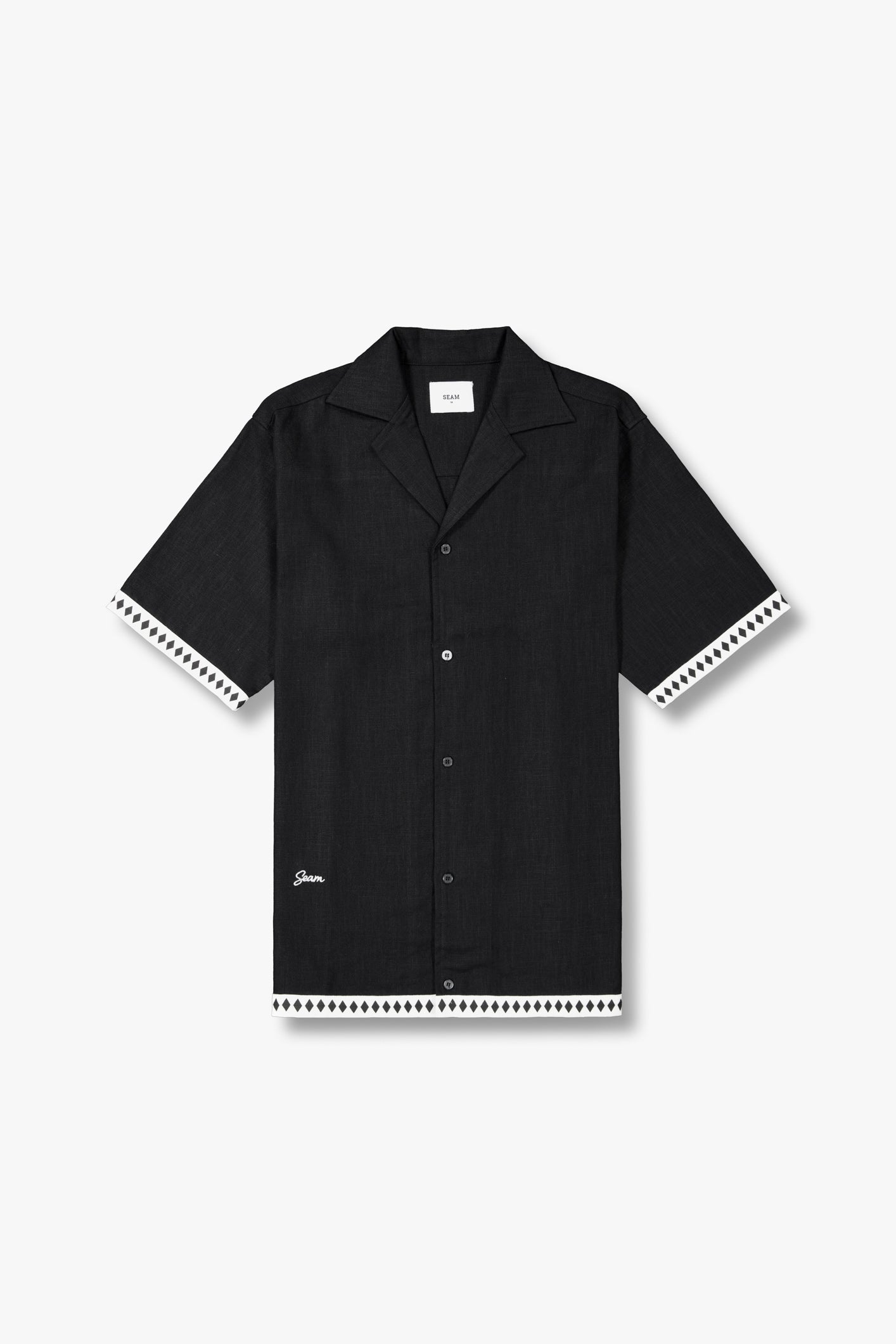 SEAM Diamond Trim Linen Shirt in Black, flat lay showing camp collar and contrast diamond trim